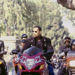 Smoke (LAURENCE FISHBURNE, center) leads a processional of motorcycle racers, flanked by two members of his Black Knights, Half & Half (SALLI RICHARDSON, left) and SOUL TRAIN (ORLANDO JONES, right), to honor a fallen member of their club.