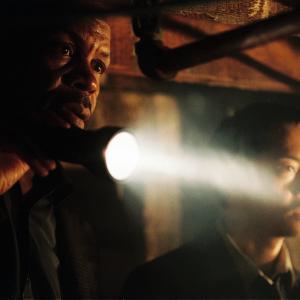 Still of Danny Glover and Ken Leung in Saw 2004