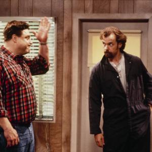 Still of John Goodman and Michael OKeefe in Roseanne 1988