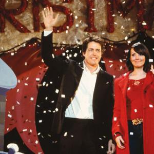 The Prime Minister (HUGH GRANT) and Natalie (MARTINE McCUTCHEON) are caught off-guard (and quite by accident) at a Christmas pageant in Richard Curtis' romantic comedy Love Actually.