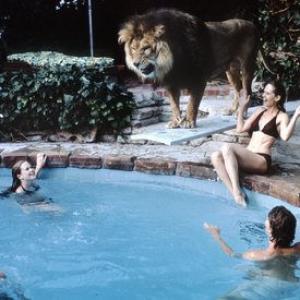 Tippi Hedren at home with her children and their pet lion (Melanie Griffith top left)