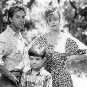 Still of Melanie Griffith Don Johnson and Elijah Wood in Paradise 1991