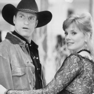 Still of Woody Harrelson and Marg Helgenberger in The Cowboy Way 1994