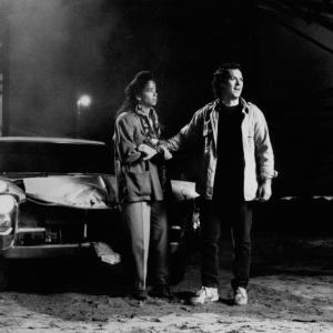 Still of Michael Keaton and Rae Dawn Chong in The Squeeze 1987