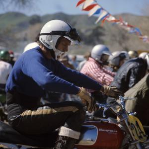 Steve McQueen racing on his Husqvarna motorcyle at Indian Dunes circa 1970s