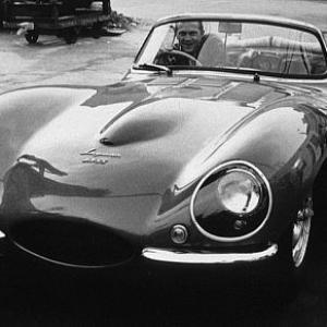 Steve McQueen in his Jaguar XK-SS in Hollywood, 1960. Modern silver gelatin, 11x14, signed. Modern silver gelatin, 16x20, signed. © 1978 Sid Avery MPTV