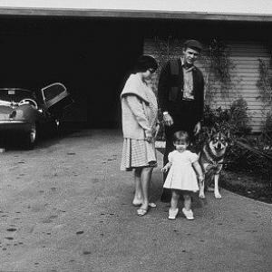 Steve McQueen at home with wife Neile, daughter Terry and his XKSS Jaguar