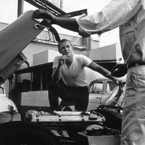 Steve McQueen talking to his XK SS Jaguar Mechanic AT Grand Prix Motos