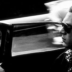 Steve McQueen in his 1957 Jaguar in Hollywood CA 1960