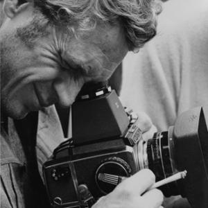 Steve McQueen taking a photograph with a Bronica camera