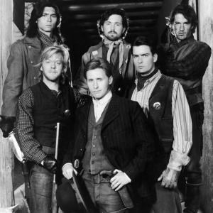 Still of Charlie Sheen, Emilio Estevez, Dermot Mulroney, Kiefer Sutherland, Lou Diamond Phillips and Casey Siemaszko in Young Guns (1988)