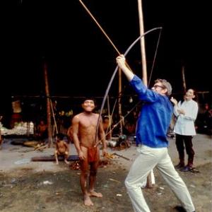 Peter OToole and his wife Sian Phillips visit the remote Venezuelian Waika tribe Peter who is strong found it almost impossible to draw the bow back much to the enjoyment of Sian and the tribesman 1970  1978 Bob Willoughby