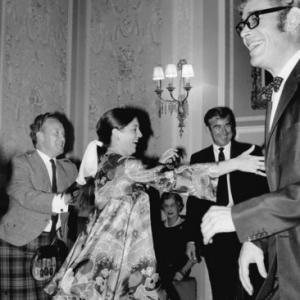 Peter OToole right dancing at the Gleneagles Hotel Scotland on the location of Brotherly Love Actor Michael Craig in background center 1967  1978 Bob Willoughby