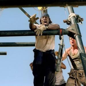 AJ (Tyrese Gibson, left) and Towns (Dennis Quaid) have strong reactions to a problem in the building of the Phoenix.