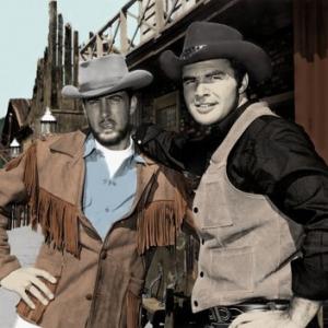 Publicity Photo of Ghost Town in the Sky where Burt Reynolds apeared as a celibrity gunfighter in 1963 Pictured with him is Harry Valentine known as Doc Valentine of the International Famed Ghost Town Gunfighters Harry Valentine will play Sheriff Parker in the movie Ghost Town