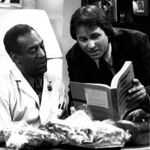 Still of John Ritter and Bill Cosby in The Cosby Show (1984)