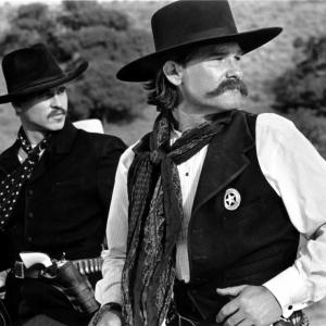 Still of Val Kilmer and Kurt Russell in Tombstone 1993
