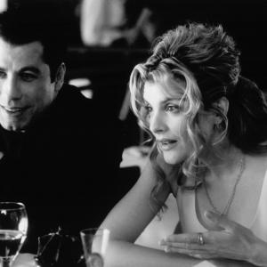 Still of John Travolta and Rene Russo in Get Shorty 1995