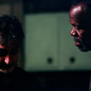 David Strathairn and Danny Glover on the set of WOODCUTTER