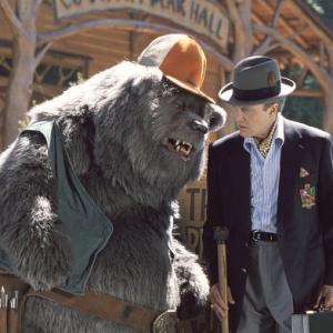 Big Al left longtime caretaker of Country Bear Hall gives the lowdown to Reed Thimple Christopher Walken right an evil banker determined to destroy the legendary venue