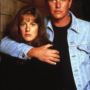 Still of Tom Berenger and Debra Winger in Betrayed 1988