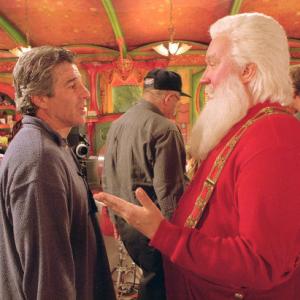 Director Michael Lembeck (left) chats off-camera with Xmas's Main Man, Santa Claus (Tim Allen, right).