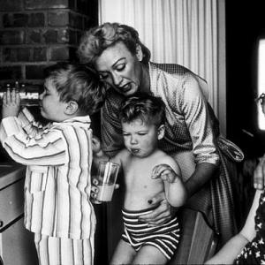 Eve Arden with her children, Douglas, Duncan, and Connie, in their kitchen, 1956.