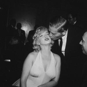 M. Monroe & Milton Berle at a party for 