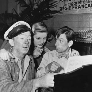 Lauren Bacall with Walter Brennan and Hoagy Carmichael on the set of To Have and Have Not