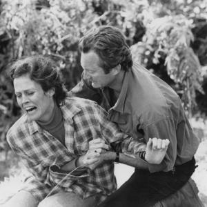 Still of Sigourney Weaver and Bryan Brown in Gorillas in the Mist The Story of Dian Fossey 1988