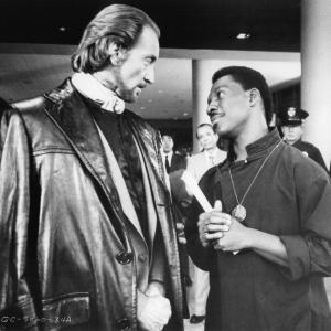 Still of Eddie Murphy and Charles Dance in The Golden Child 1986