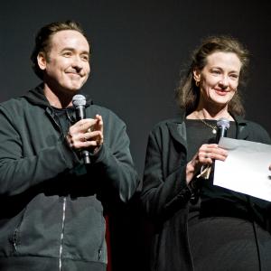 John and Joan Cusack attend the Roger Ebert Memorial Tribute at Chicago Theatre on April 11 2013 in Chicago Illinois