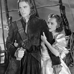 Still of Olivia de Havilland and Errol Flynn in Captain Blood 1935