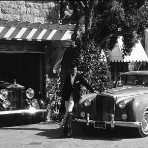 George Hamilton at home with his Rolls Royce and Bentley