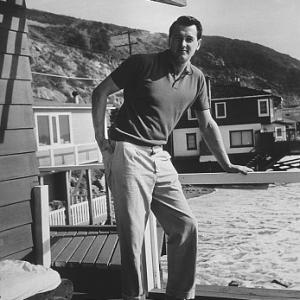 Rock Hudson at his Malibu beach home c1960