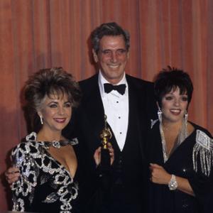 Elizabeth Taylor with Rock Hudson and Liza Minnelli at The 42nd Annual Golden Globe Awards