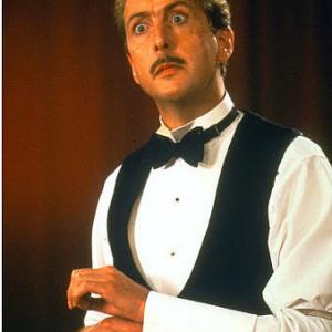 Still of Eric Idle in The Meaning of Life 1983