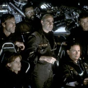 (Beginning lower left and clockwise) Hilary Swank as Beck, Aaron Eckhart as Josh, Delroy Lindo as Brazzleton, Stanley Tucci as Zimsky, Bruce Greenwood as Richard, and Tchely Karyo as Serge.