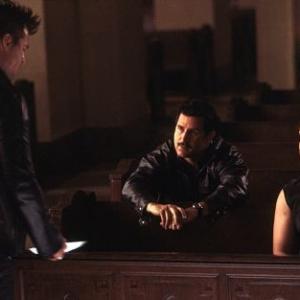Danny (Val Kilmer) meets cops Garcetti (Anthony LaPaglia) and Morgan (Doug Hutchison) in a church.