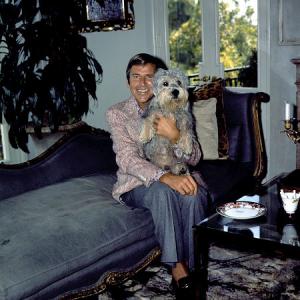 Paul Lynde at home with his dog c 1973