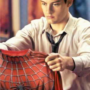 TOBEY MAGUIRE stars as Peter Parker in Columbia Pictures action adventure SPIDERMAN rated PG13 for stylized violence and action