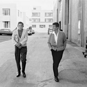 Dean Martin walking with his assistant, Mack Gray