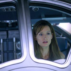 Rheya (Natascha McElhone) cannot comprehend her own sudden appearance on a space station orbiting a mysterious planet.