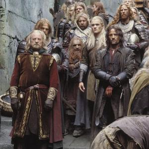 (left to right) King Theoden (Bernard Hill), Gimli (John Rhys-Davies) Legolas (Orlando Bloom) and Aragorn (Viggo Mortensen) survey the interior walls of Helm's Deep.