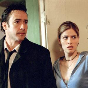Still of John Cusack and Amanda Peet in Identity 2003
