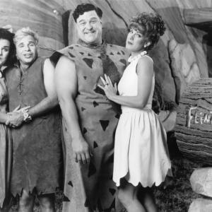 Still of John Goodman, Rick Moranis, Elizabeth Perkins and Rosie O'Donnell in The Flintstones (1994)