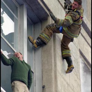 Jack Morrison (Joaquin Phoenix, right) proves his bravery as he risks his life to save a trapped man.