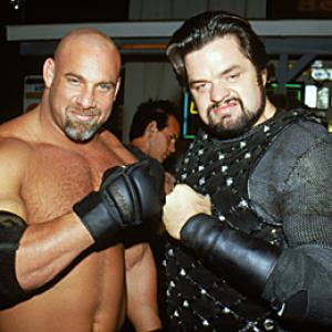 Bill Goldberg appearing as himself poses with Oliver Platt appearing as Jimmy King