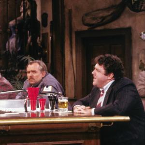 Still of John Ratzenberger and George Wendt in Cheers (1982)