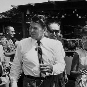 Ronald Reagan with wife Nancy campaigning at a county fair C 196465